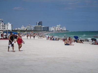 People enjoying the clear skies and sun at Miami's South Beach.