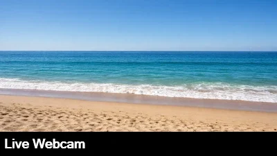 Close up, ground level view of the beach and surf in Aliso Beach, California.
