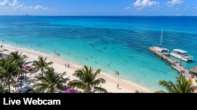 View from the top of the Breathless Soul Resort and Spa looking down on the beach and Caribbean with Isla Mujeres in the background.