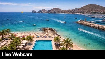 Live view of the beach, pool and harbor as the boats come and go.