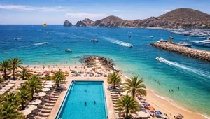Live view of the beach, pool and harbor as the boats come and go.
