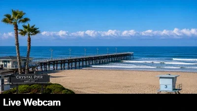 Live view of Crystal Pier and the surrounding beach area.