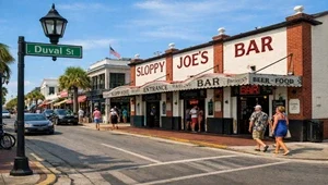 Live view of Duval Street in front of the famous Sloppy Joe's Restaurant and Bar in Key West Florida.
