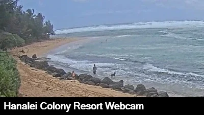 Live view of the rock lined beach and surf from the Hanalei Colony Resort webcam