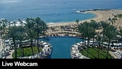Live view overlooking the infinity pool with the beach and ocean in the background.