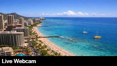 View from the very top of the Hilton Waikiki looking down at the beach and ocean.