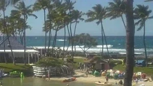 Live view of the swimming lagoon with the ocean in the background at the Hilton Waikoloa Village
