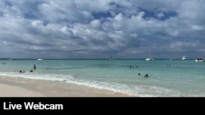 Beautiful view of the white sand and turquoise Caribbean in Isla Mujeres Mexico