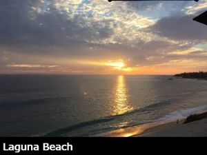 Colorful sunset over the ocean and breaking waves in Laguna Beach California