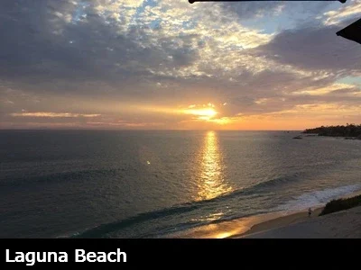Colorful sunset over the ocean and breaking waves in Laguna Beach California