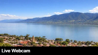 Live view looking out over the lake with the mountains in the background,