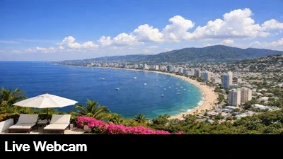 Live view looking down at Acapulco Bay with the downtown skyline in the background.