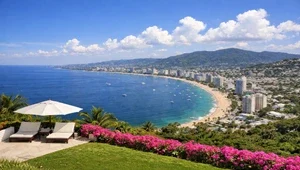 Live view looking down at Acapulco Bay with the downtown skyline in the background.