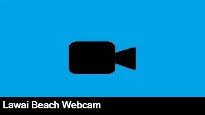 Live view from the Lawai Beach Resort webcam looking out over the entrance to the resort and the ocean.