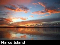 Beautiful orange and yellow sunset reflecting on the water in Marco Island Florida