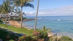 View of the beach and offshore reef as waves gently break