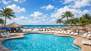 Live view of the pool and spa area with the beautiful Caribbean in the background.