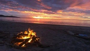 Beautiful orange and yellow sunset over Costa Rica's Playa Flamingo.