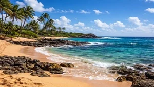 Live view of the waves crashing against the rocks on the point adjacent to Poipu beach is Kauai Hawaii.