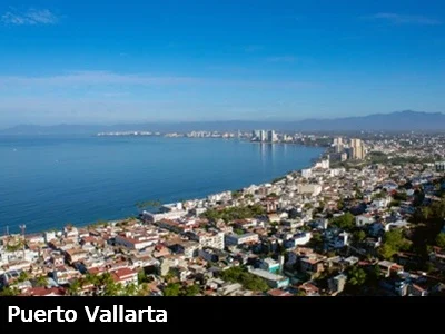 View from above looking down towards downtown Puerto Vallarta and the calm Pacific Ocean