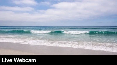 Live view of the beach and surf from Rosarito, Mexico.
