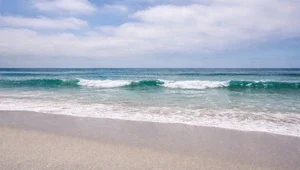 Live view of the beach and surf from Rosarito, Mexico.