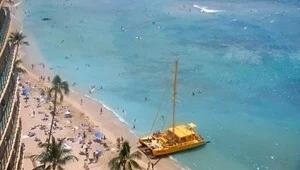 Live view from the top of the Royal Hawaiian Waikiki looking down at famous Waikiki beach and the beautiful ocean.