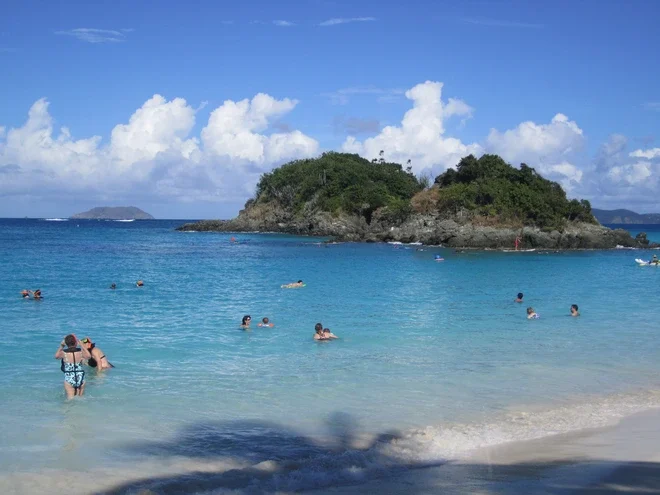 Snorkelers swim around St John's famous Trunk By with its clear, turquoise waters