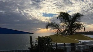 Live view of the beach below from the Cliff Restaurant high above the Pacific Ocean.