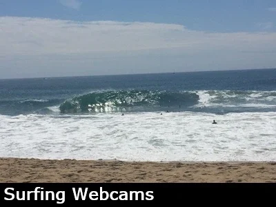 Huge waves breaks at the Wedge in Newport beach and surfers try to catch a ride