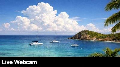 Live view from the Pink House Villas overlooking the turquoise Caribbean and boats moored in White Bay.